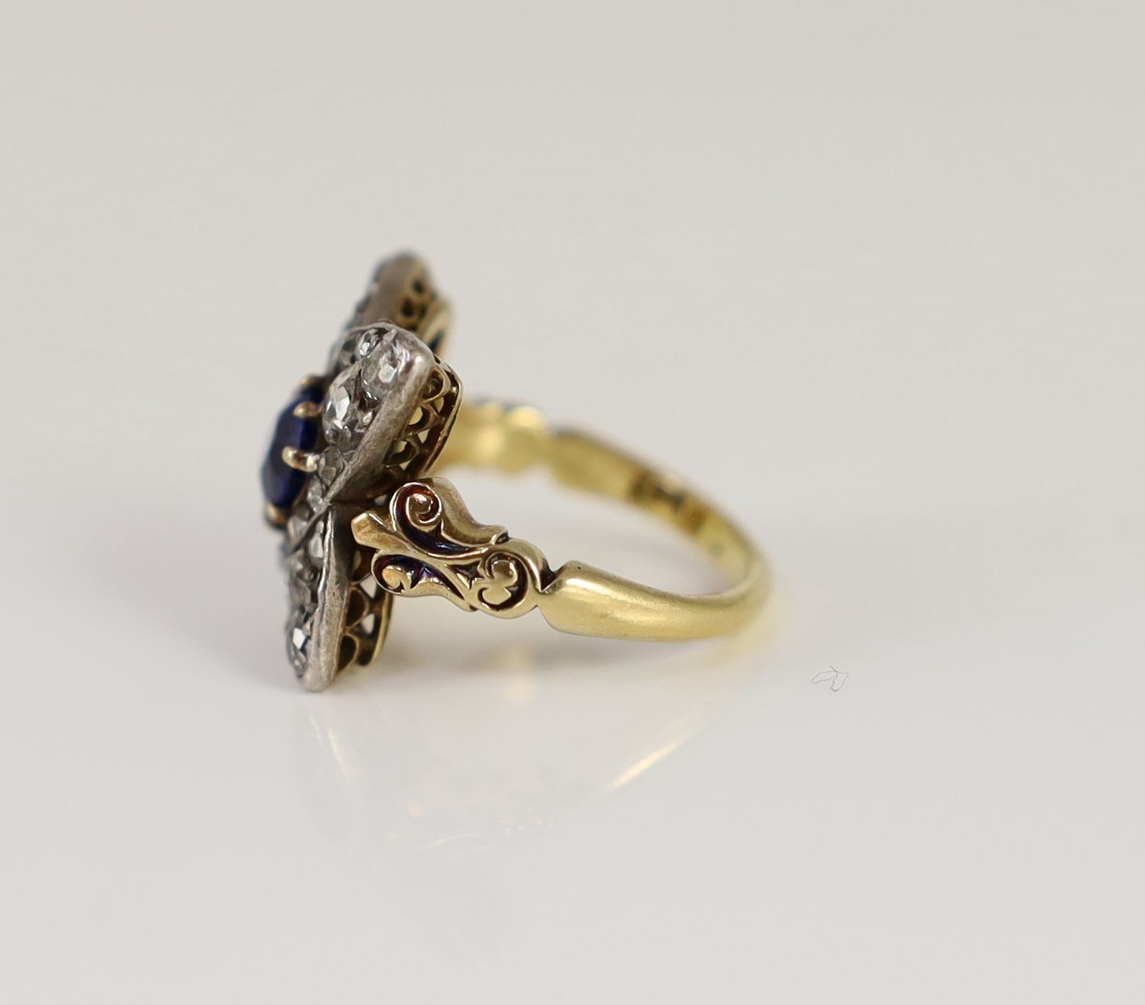 A mid 20th century 18ct gold, sapphire and diamond star shaped cluster dress ring